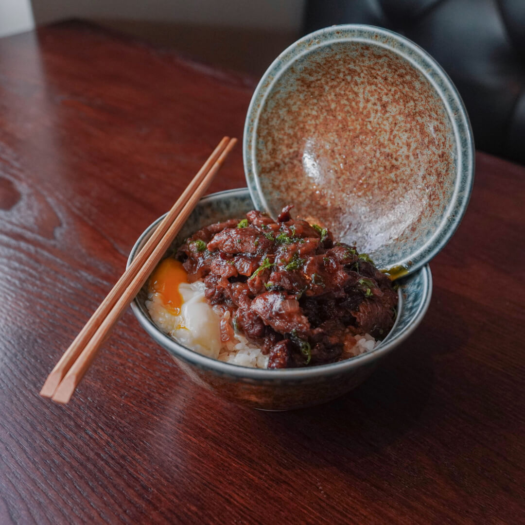 Sukiyaki don — marinated thinly sliced ribeye over rice with a soft egg