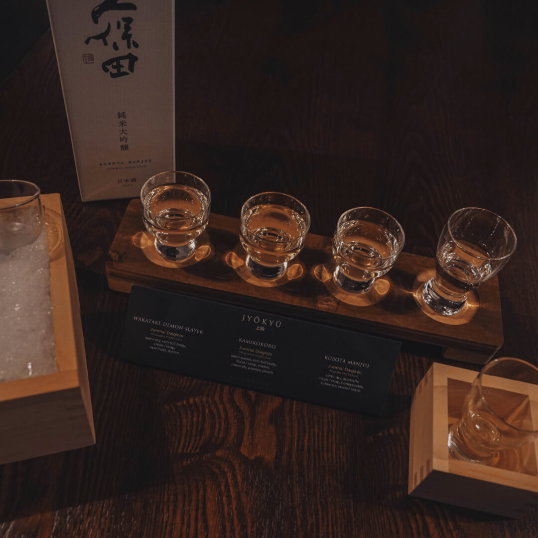 Sake flight with tasting notes for Wakatake Demon Slayer, Kamikokoro and Kubota Manjyu