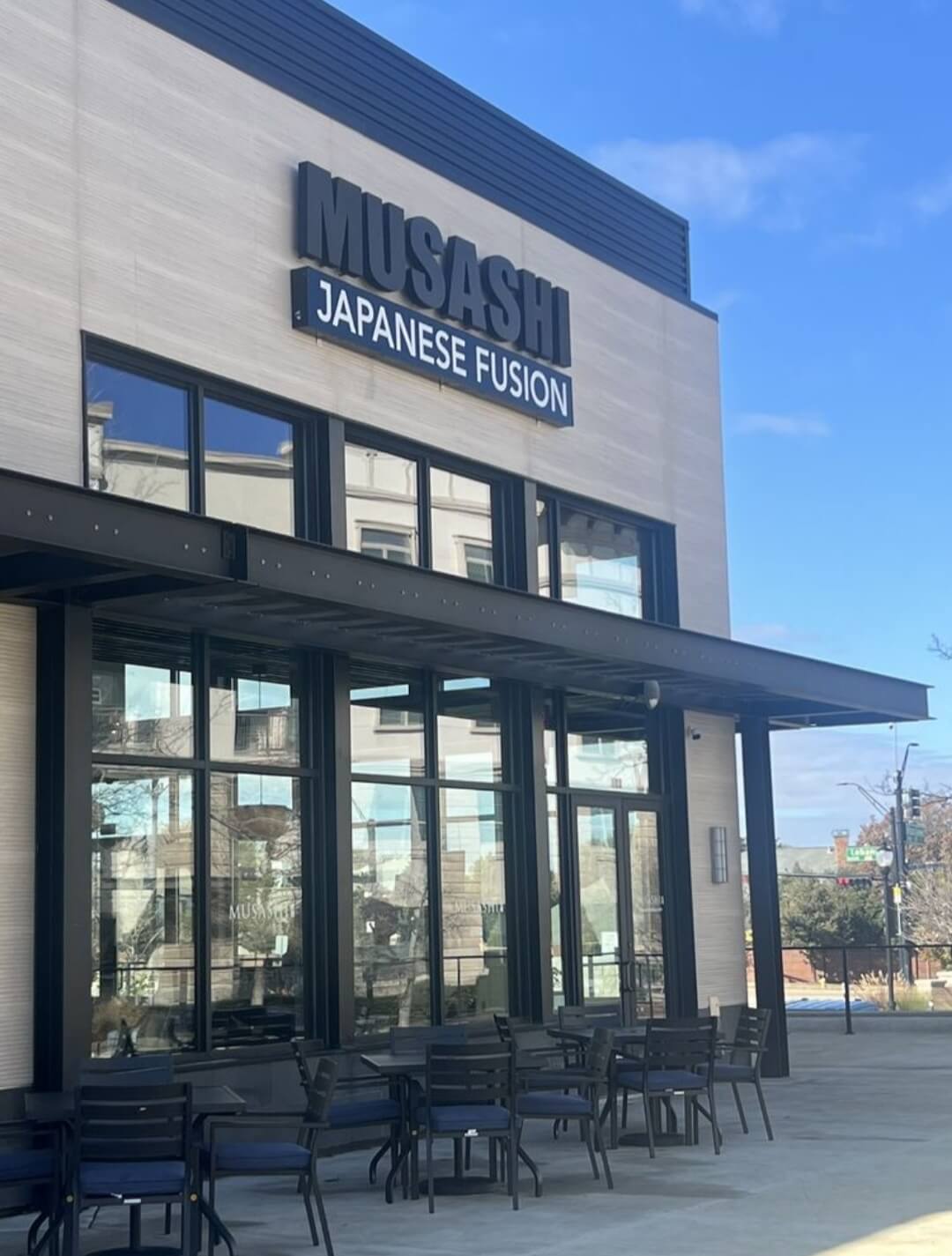 Musashi Japanese Fusion storefront signage and patio seating in Frisco, TX