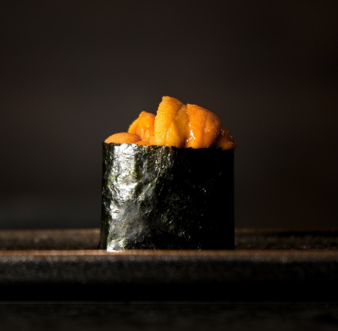 Uni gunkan nigiri — sea urchin wrapped in a band of nori
