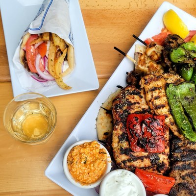 Chicken souvlaki platter with wine