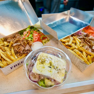 Gyro and fries with Greek salad