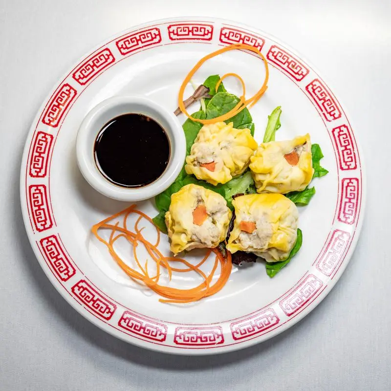 Steamed pork dumplings with dipping sauce